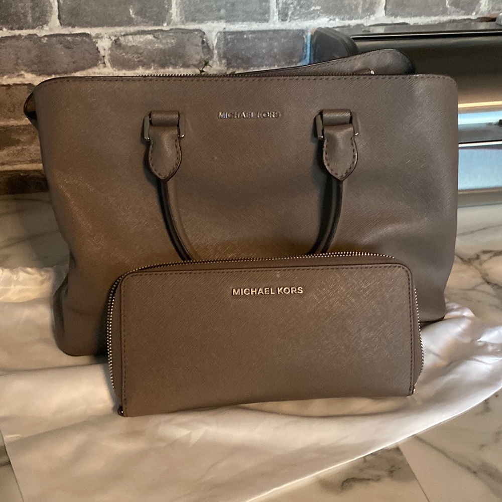 Mint condition authentic Michael Kors with matching wallet,